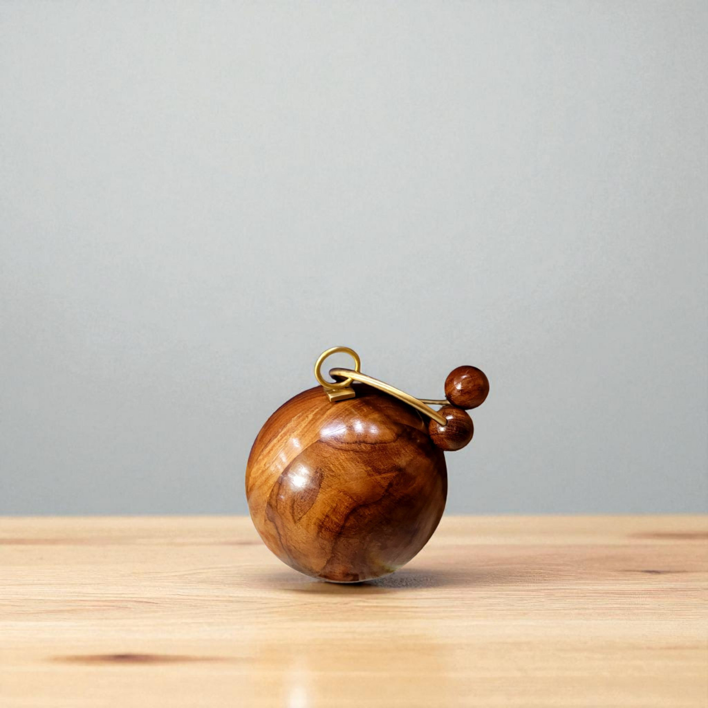 Wooden Spherical Clutch | Brass Bracelet Handle